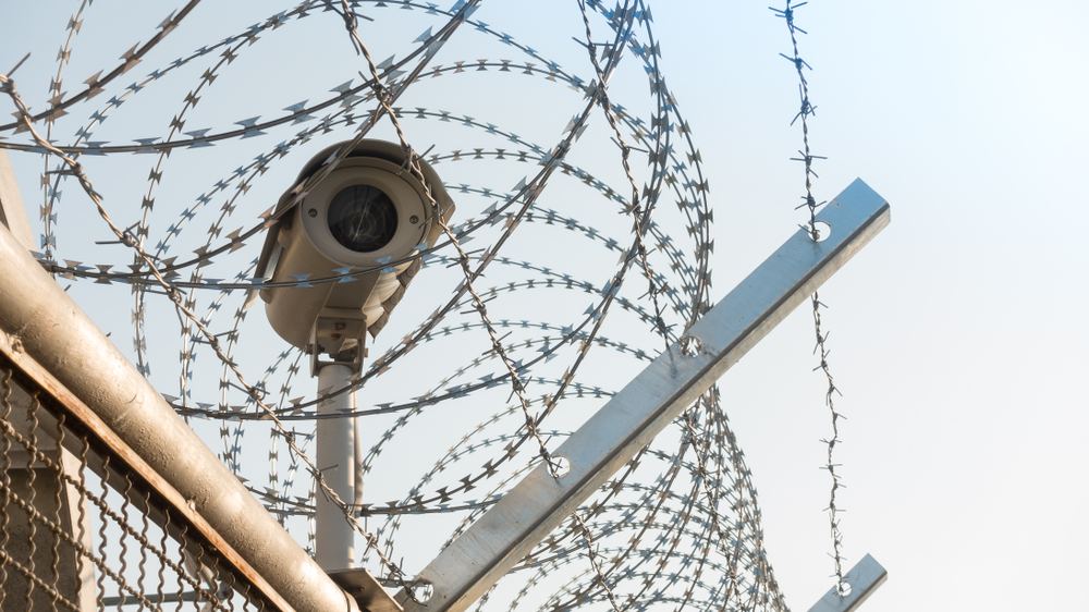 Camera at perimeter with barbed wire