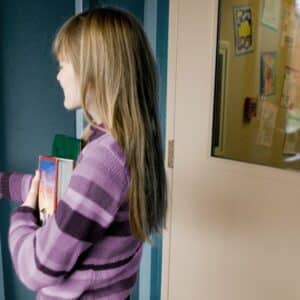 School security - young woman at a dorm door