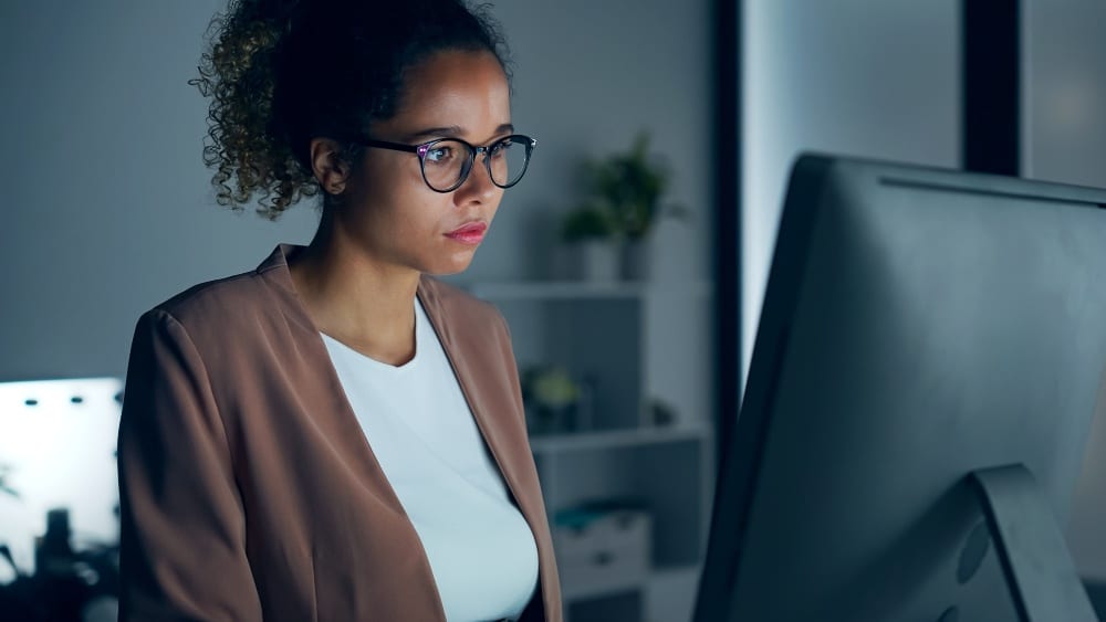 Woman on computer - interoperability