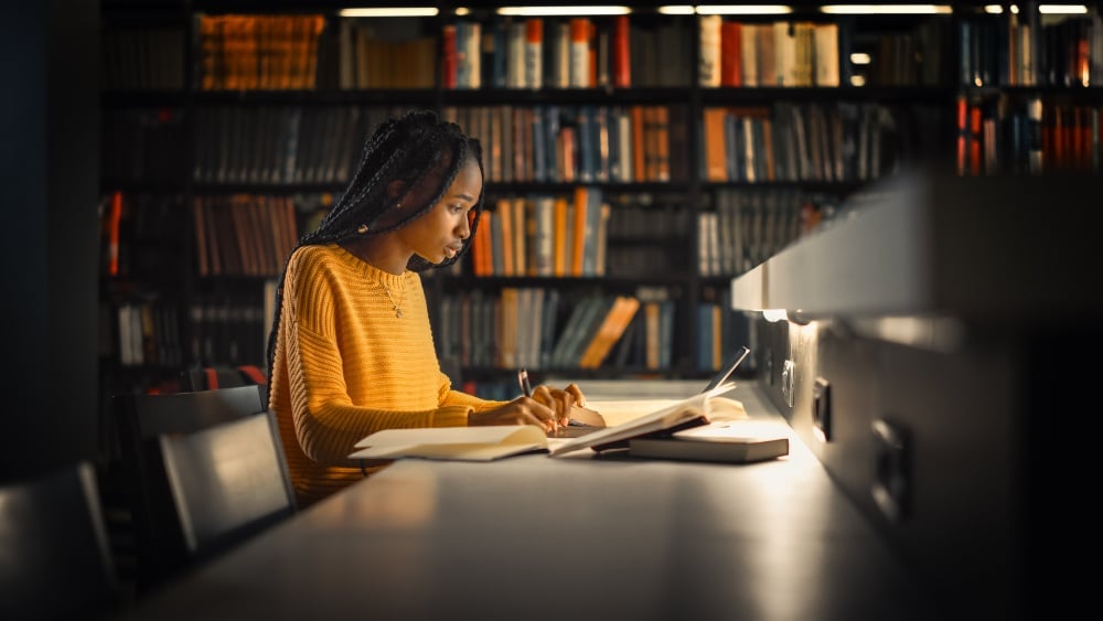 Student in library on campus